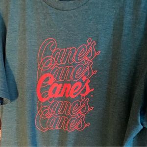 Raising Cane’s Orange on Green Fan Tee